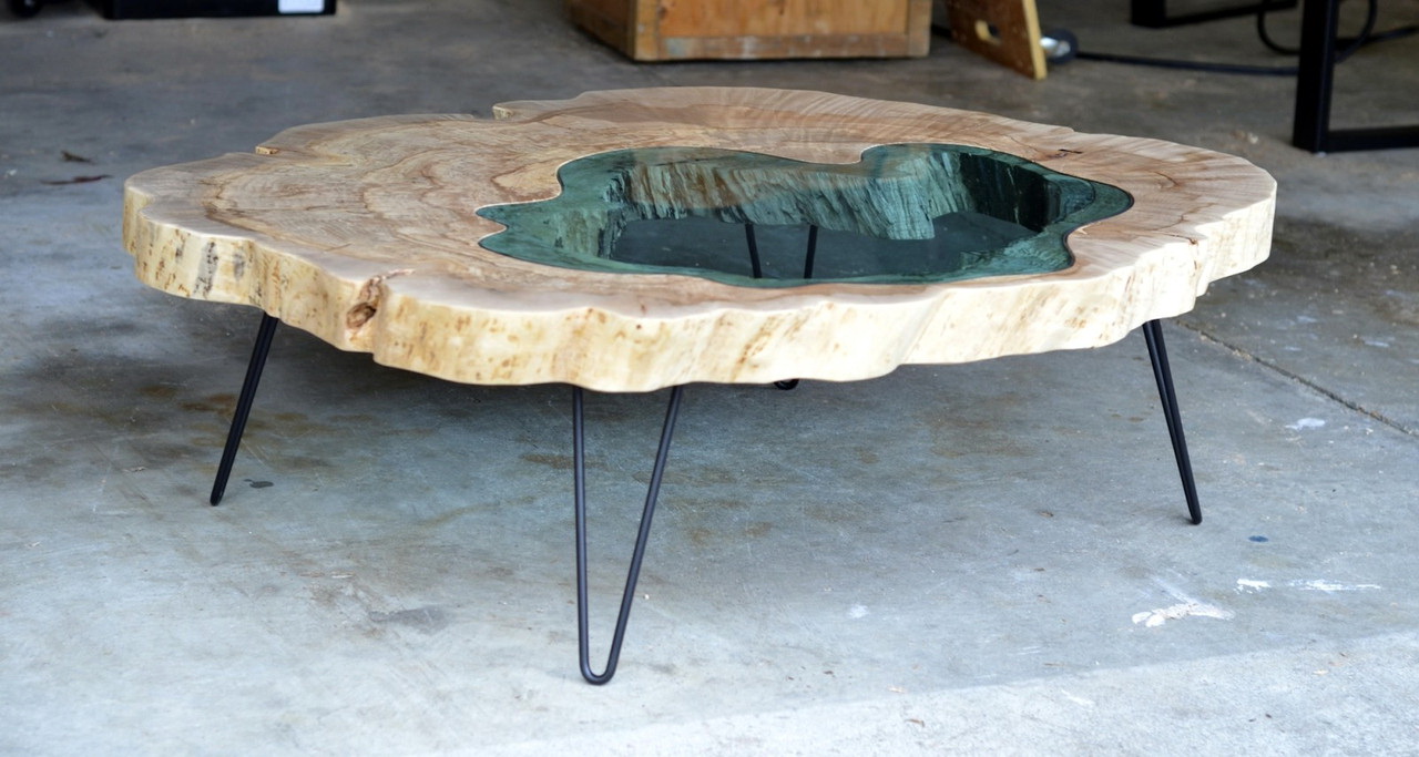 An interesting example of a stylish and unusual room decor is an epoxy table.