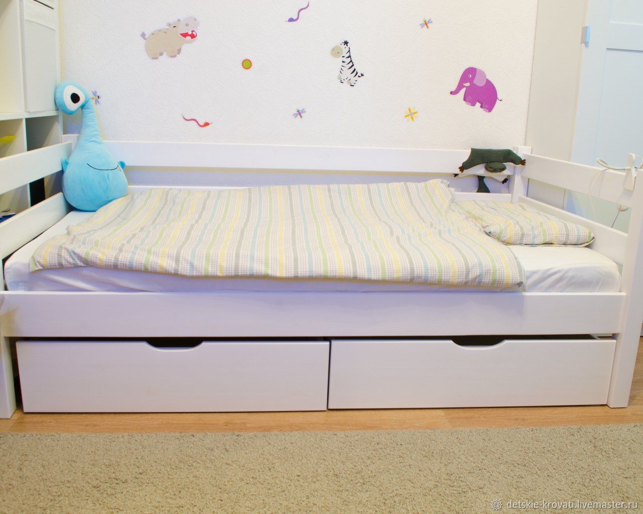 Bed for a child with large drawers
