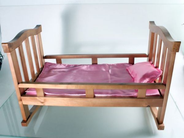 Rocking bed for a doll wooden