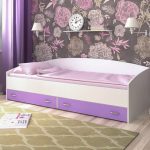 Bed for the girl with drawers