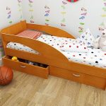 Children's bed with sides