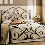 With wrought iron back and headboard