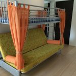 Metal bed with curtains